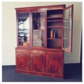 An exquisitely made "Rosjohn" three-glass door show cabinet with drawers and cupboard space