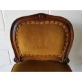 An amazing and unusual antique Mahogany bar chair with long legs and a mustard colour upholstery!!