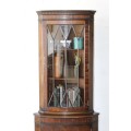 A fantastic Edwardian antique corner display cabinet with a glass door and spacious bottom cupboard