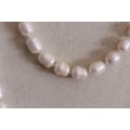 A beautiful 126cm endless-strand of white cultured baroque pearls in stunning condition