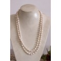 A beautiful 126cm endless-strand of white cultured baroque pearls in stunning condition