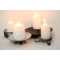 **RS17** Four lovely assorted metal candle holders, perfect in informal living areas.