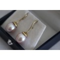 A stunning pair of pink Japanese Akoya pearl earrings with 9ct gold hooks in its original gift box