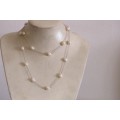 A stylish 89cm long endless-strand of white cultured baroque pearls on a silver chain - stunning!!