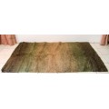 **RS17** A stunning Glowbal shaggy carpet with mixed shades of green and brown colours