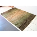 **RS17** A stunning Glowbal shaggy carpet with mixed shades of green and brown colours