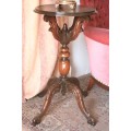 An exquisite hand-carved round Imbuia occasional/ side table with a solid turned centre base.