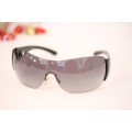 An awesome pair of black Italian made Prada (model SPR22M) ladies sunglasses w/ grey gradient lenses