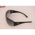 An awesome pair of black Italian made Prada (model SPR22M) ladies sunglasses w/ grey gradient lenses