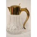 A spectacular lead crystal water jug with a cooler for ice, brass lid and handle in good condition