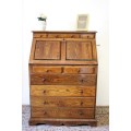 A wonderful vintage Adam Bede solid Oak fall-top writing bureau w pigeon holes and large drawers