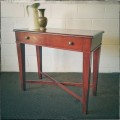 An incredible stylish "Benchmark Wood Classics" one-drawer Mahogany console table w fall-down door