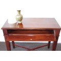An incredible stylish "Benchmark Wood Classics" one-drawer Mahogany console table w fall-down door