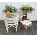 **RS17** A white painted wicker "all weather" outdoor/ patio table with a glass top and a chair