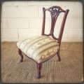 **RS17** A hand-carved antique Victorian slipper/ nursing chair upholstered in a beautiful fabric