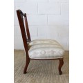 **RS17** A hand-carved antique Victorian slipper/ nursing chair upholstered in a beautiful fabric