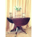 A fabulous stylish vintage drop leaf occasional table with ornate brass capped feet on castors