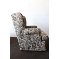 A wonderful upholstered rocker armchair with a matching ottoman - both in good condition!!