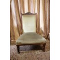 **RS17**  A hand-carved antique Victorian slipper/ nursing chair upholstered in a soft green fabric