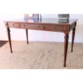 A beautifully detailed vintage Mahogany Regency leather-top library desk with drawers & fluted legs