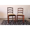 **RS17** Two solidly made vintage/ antique? solid teak occasional chairs in a sand colour fabric