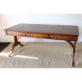 A beautiful vintage Regency styled ladies embossed leather-top 3-drawer writing desk on castors