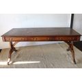 A beautiful vintage Regency styled ladies embossed leather-top 3-drawer writing desk on castors