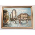 A beautiful framed original signed oil painting of a town scene.