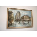 A beautiful framed original signed oil painting of a town scene.