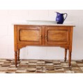 A wonderful vintage solid Oak double door wash stand with a white marble top on castors - stunning!