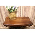 A fabulous vintage Teak hallway/display table with ornate carved finial & detailing at the bottom