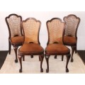 A beautiful set of 4x vintage solid Imbuia ball and claw dining chairs w/ woven rattan backrests