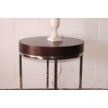 A wonderful modern styled round steel frame coffee/ side table with a broad wood profile