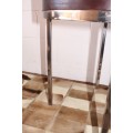 A wonderful modern styled round steel frame coffee/ side table with a broad wood profile