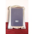 Stylish ornately decorated British hallmarked "R Carrs" sterling silver free-standing picture frame