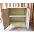 A sturdy metal multi purpose cabinet with a large cupboard, needs some tlc, perfect to paint!