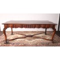 A vintage stink-wood scalloped edge ball and claw cross-brace 6-8-seater D/Table. Lifespace Sale
