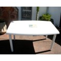 A sturdy white plastic six seater table perfect for a garden, patio/ lapa etc