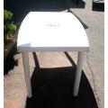 A sturdy white plastic six seater table perfect for a garden, patio/ lapa etc