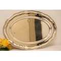 A gorgeous large silver plated platter with an elegant design.