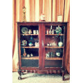 A beautifully made vintage solid Imbuia ball & claw two glass door showcase/ bookcase
