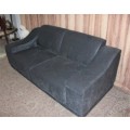 A fantastic ultra modern, "new" extremely well made (195cm long) 2 seater grey upholstered couch.