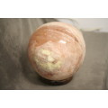 An amazing Himalayan Crystal Salt lamp on a wooden base in complete working condition