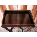 A lovely wooden butlers tray w/ removable tray, perfect for extra serving space around the house.