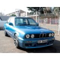 A highly collectible 1989 BMW (E30) converted to 325IS Coupe in metallic blue 99% restored.