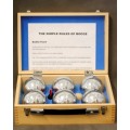 An awesome set of six chrome Chinese Boule balls in a wooden case with instructions for play.
