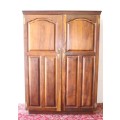 An awesome vintage solid Imbuia 2-door wardrobe with ample hanging space and packing space