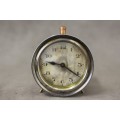 A gorgeous vintage mini round silver metal wind up clock, working.