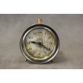 A gorgeous vintage mini round silver metal wind up clock, working.
