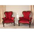An elegant pair of antique Victorian styled arm chairs w/ button detailing & gorgeous fabric.